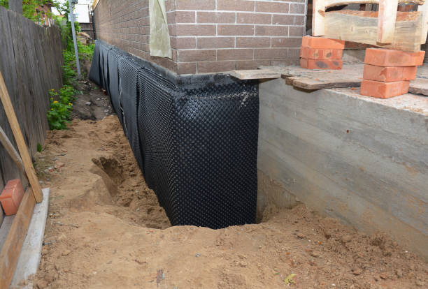 Happy homeowners after waterproofing job in Hines